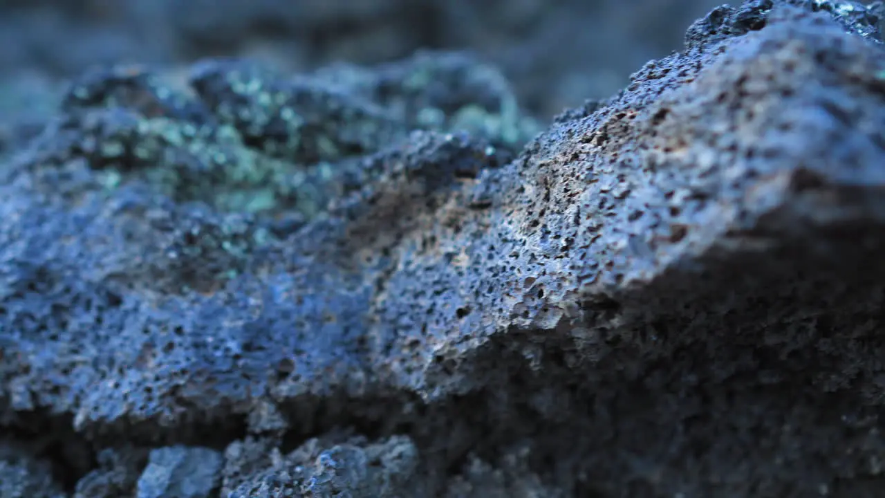 Close Up Of A Black Lava Stone Rock Formation Dolly Left