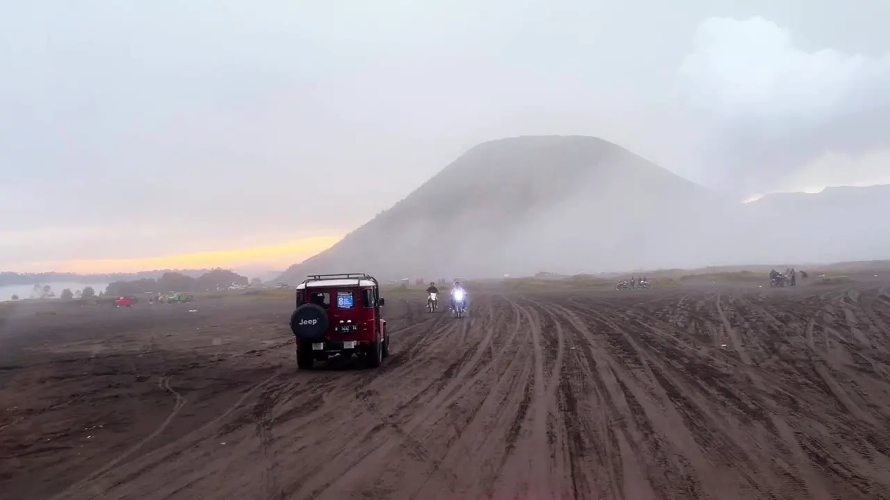 Jeep SUV driving on desert with exotic mountain view