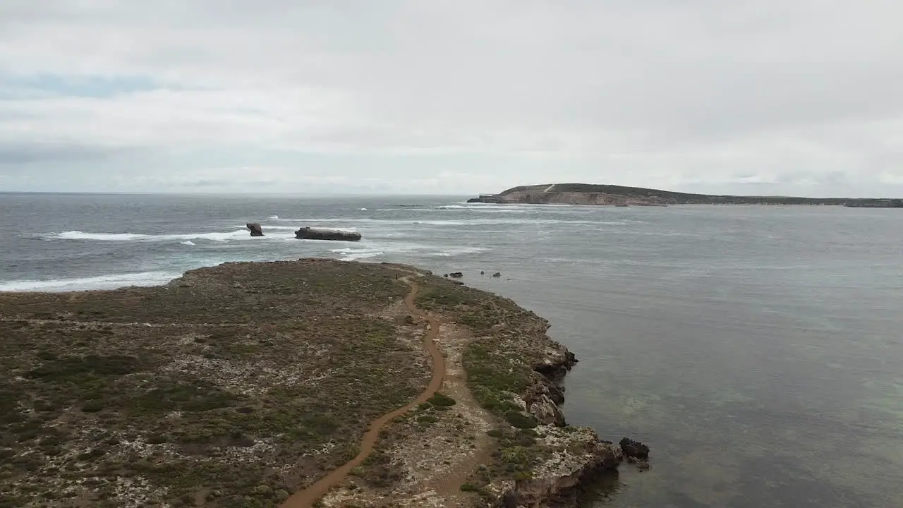 Entrance to a bay or port and a rocky headland