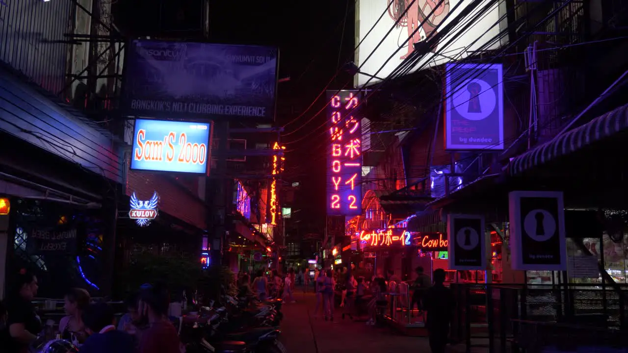 Soi Cowboy bar signs and street life