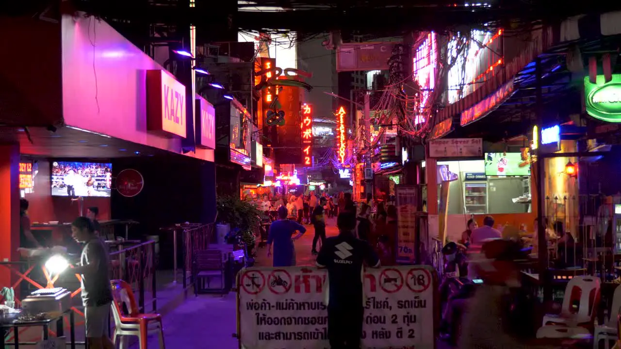 Entrance of Soi Cowboy security guard standing at the Red Light District