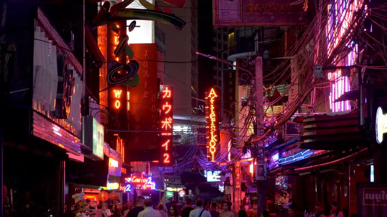 Wide Shot of Neon Signs Red light district in Bangkok Thailand