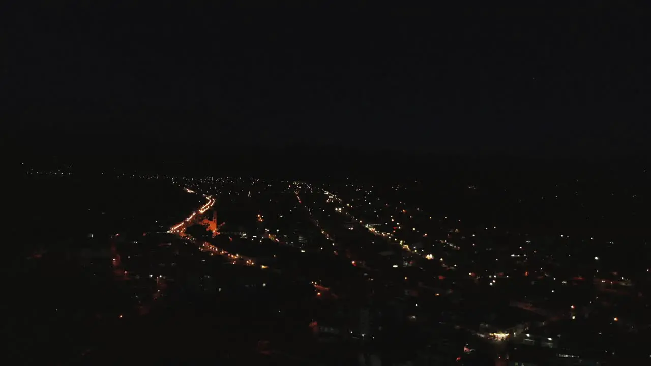 town at night takes aerial drone