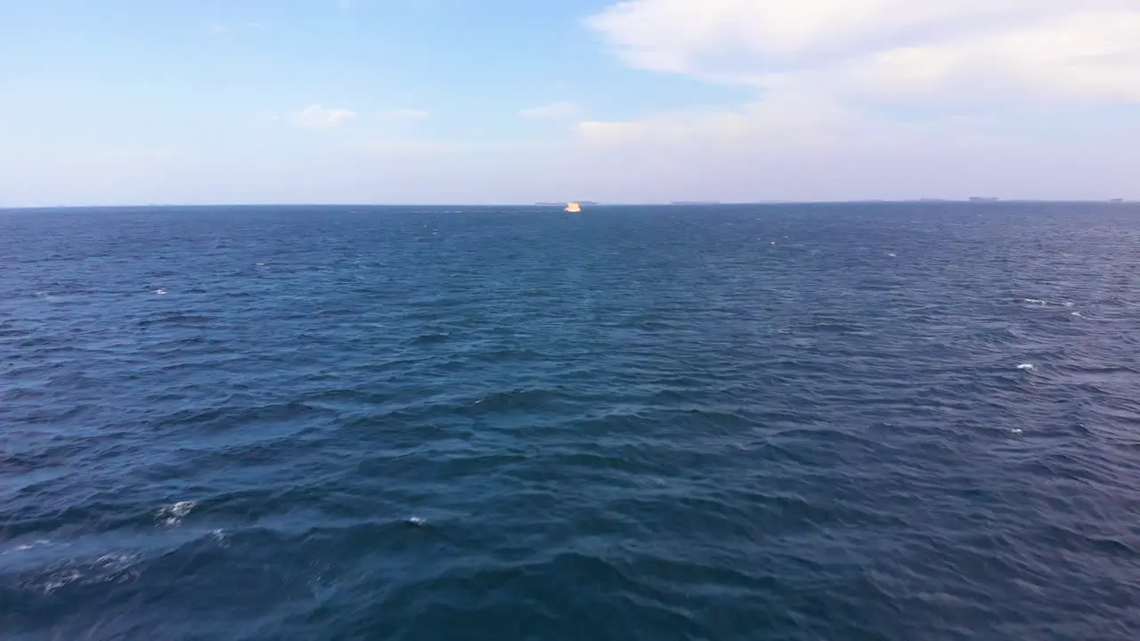 Aerial Shot Flying towards a yellow sea platform