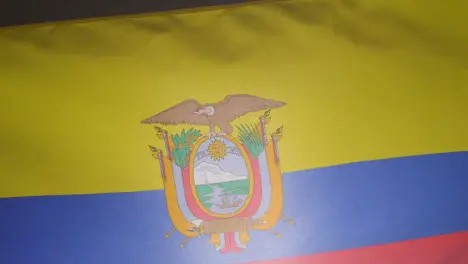 Close Up Studio Shot Of Ecuadorian Flag Flying Filling Frame