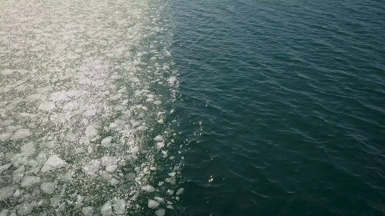 Cinematic downward angle drone shot of sea ice near the Selfoss area in Iceland