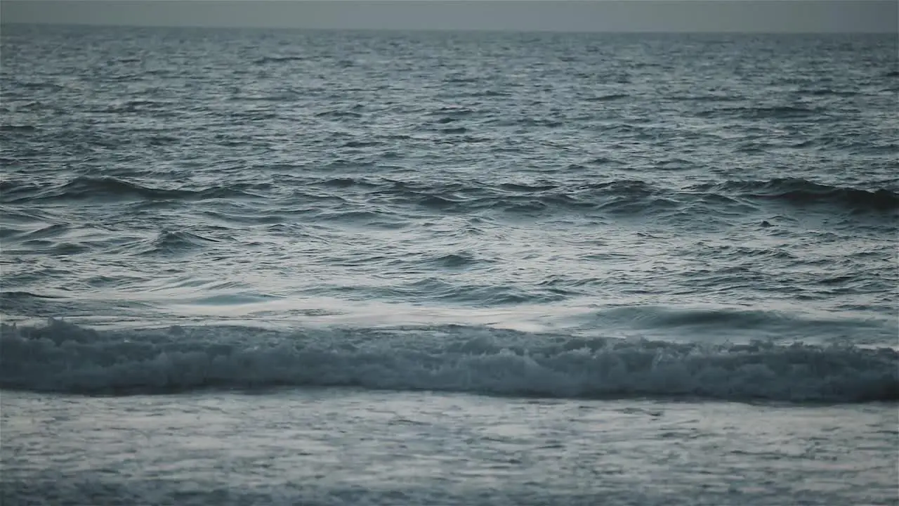 Slomo gimbal shot of sea waves during sunset