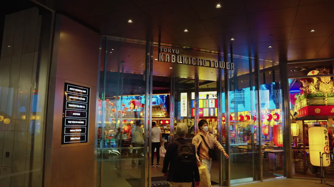 Slow motion panning shot of front of Kabukicho Towers