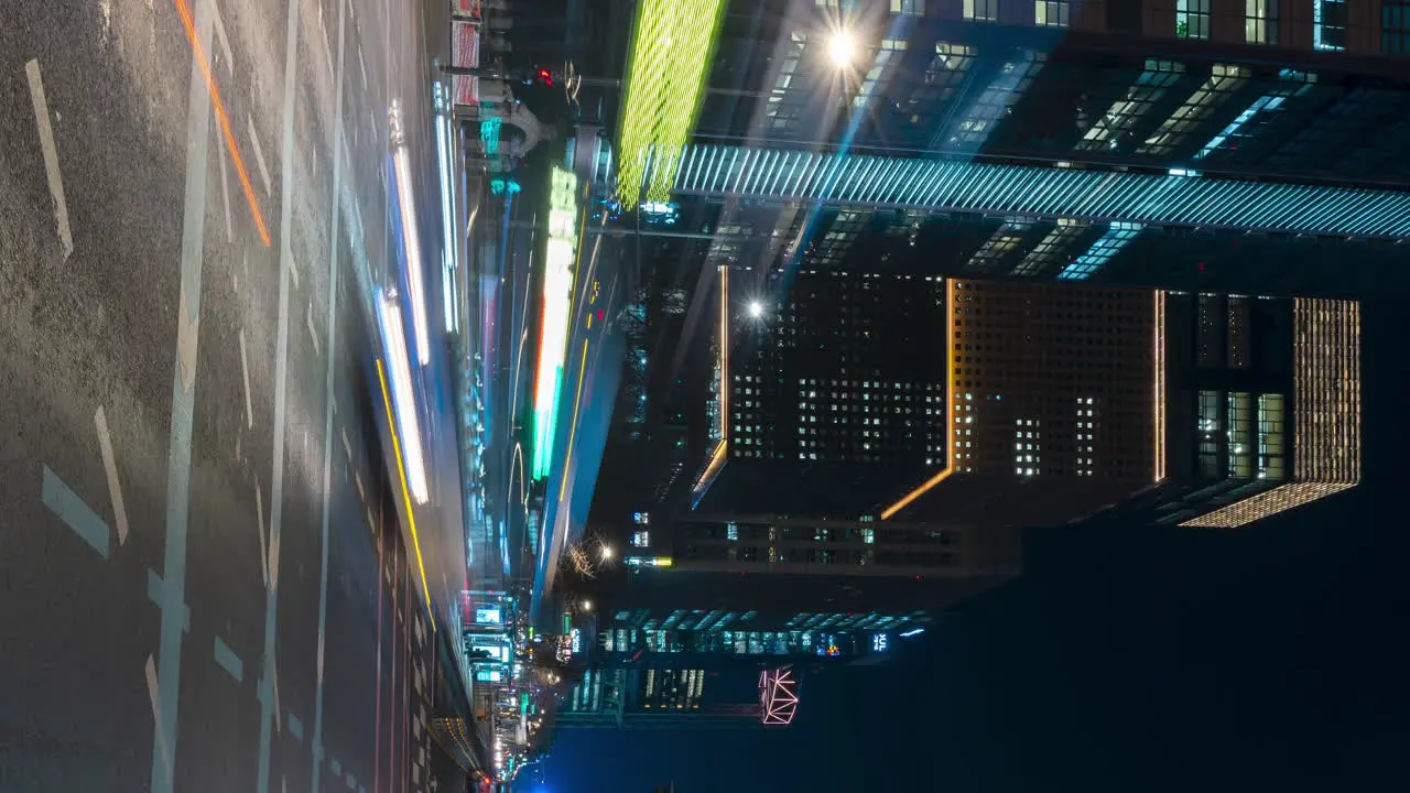 Busy night car traffic timelapse in Seoul downtown on Jong-ro street by Gwanghwamun Station Vertical panning motion