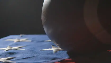 Close Up Studio Shot Of American Football On Stars And Stripes Flag 7