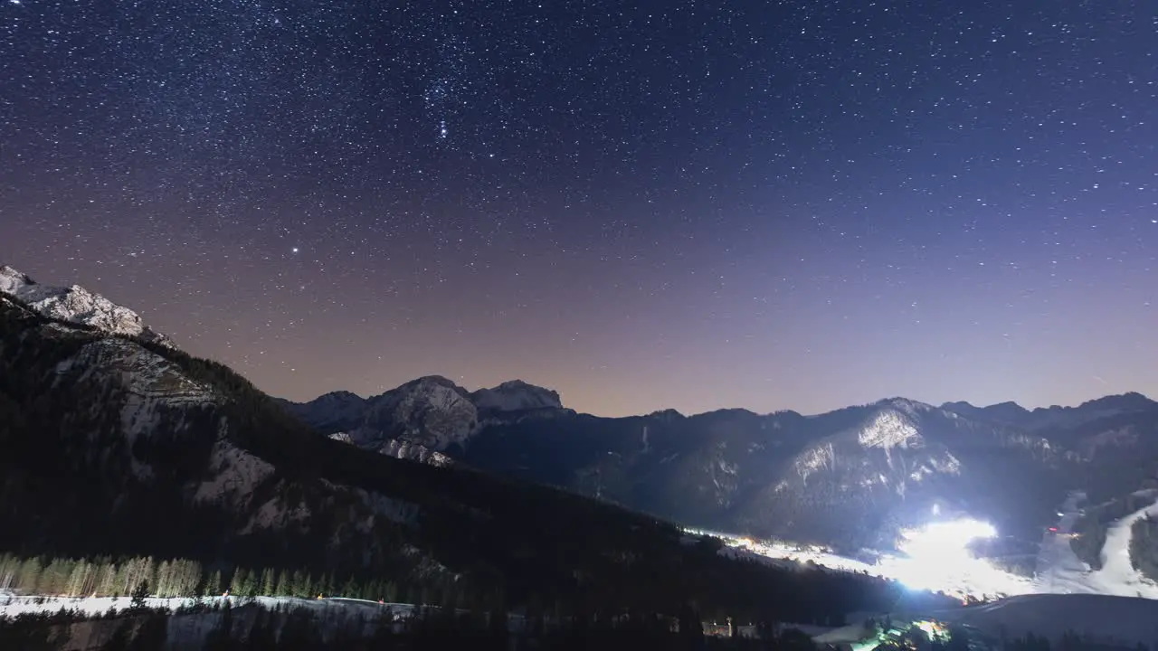 All night timelapse of the night sky and the valley near San Vigilio Northern Italy