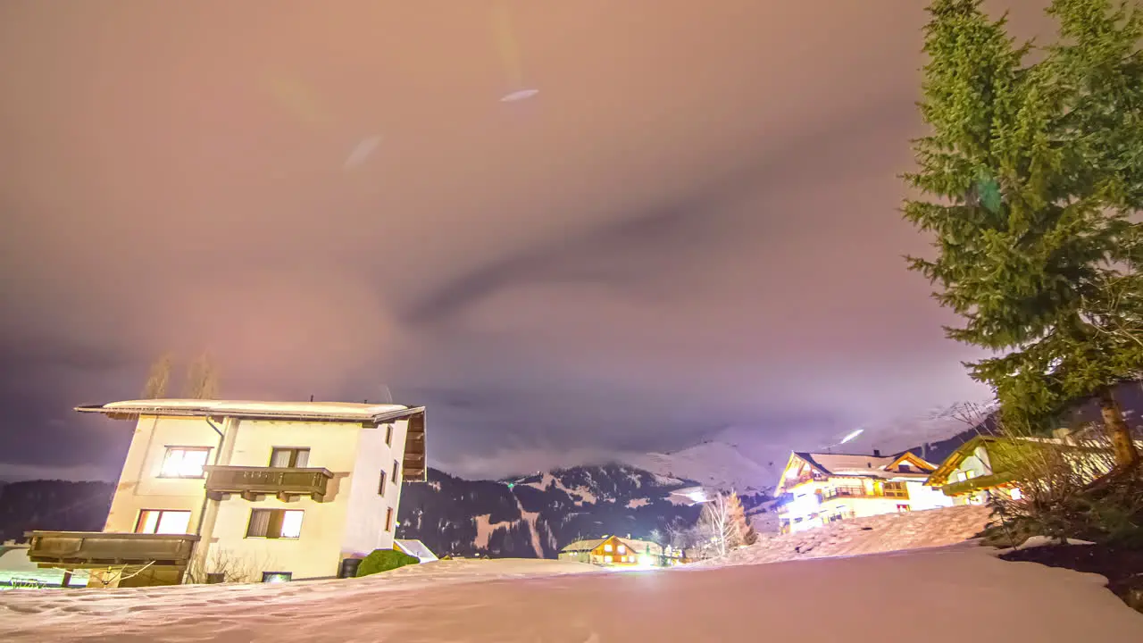 Milky Way Galaxy spin above snow covered rural town fusion time lapse