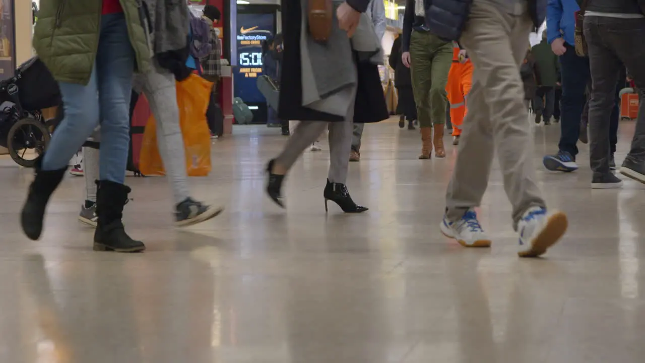 Feet walking in train station in slow motion