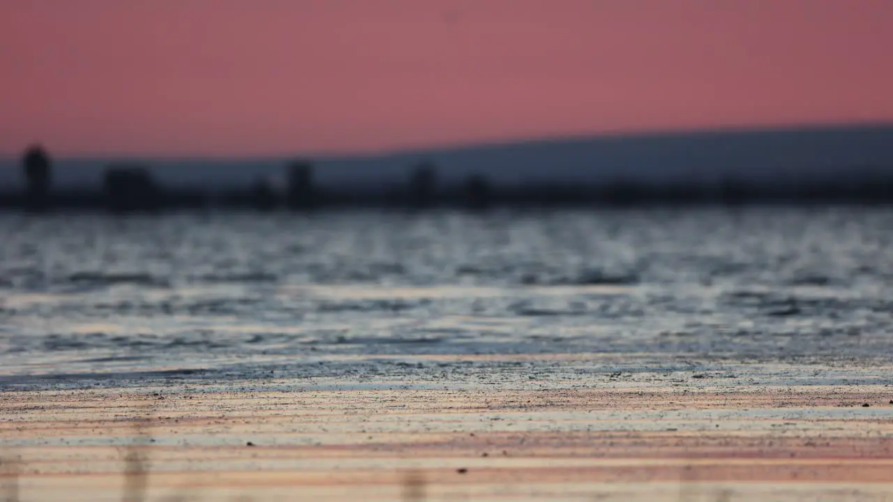 Tranquil Lake With Rippling Water During Sunrise Defocus