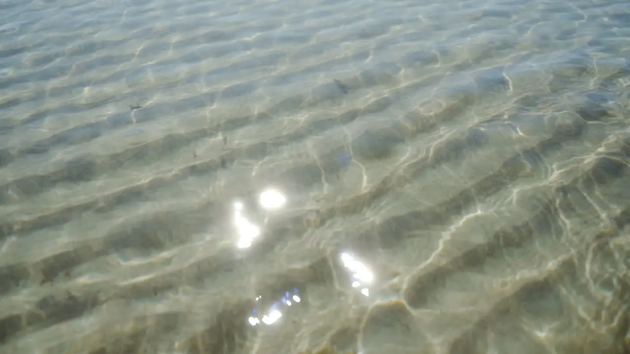 Sun reflects shallow beach sandy sand waves wave dune island travelling tourist destination visit yoga meditation calm relaxing background ambience resting seaside fish sand castle looping exotic fun