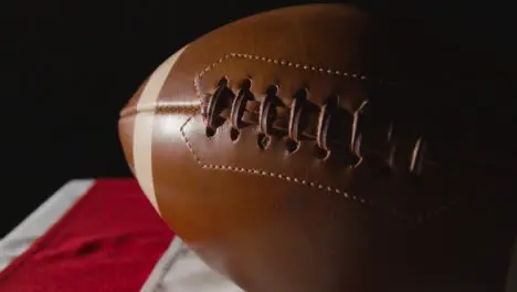 Close Up Studio Shot Of American Football On Stars And Stripes Flag 10