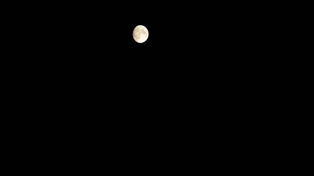 Time Lapse shot of the moon moving through the night sky