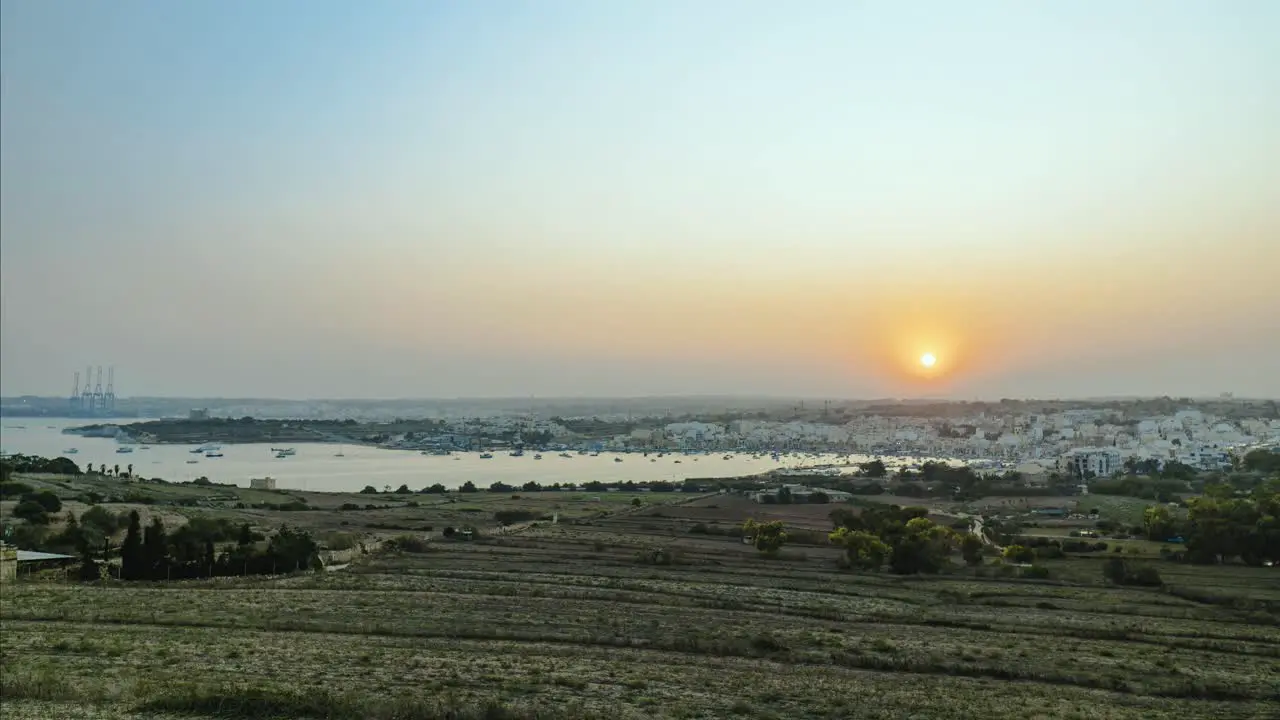 Holy Grail Sunset Timelapse overlooking Marsaxlokk and the Freeport in Malta