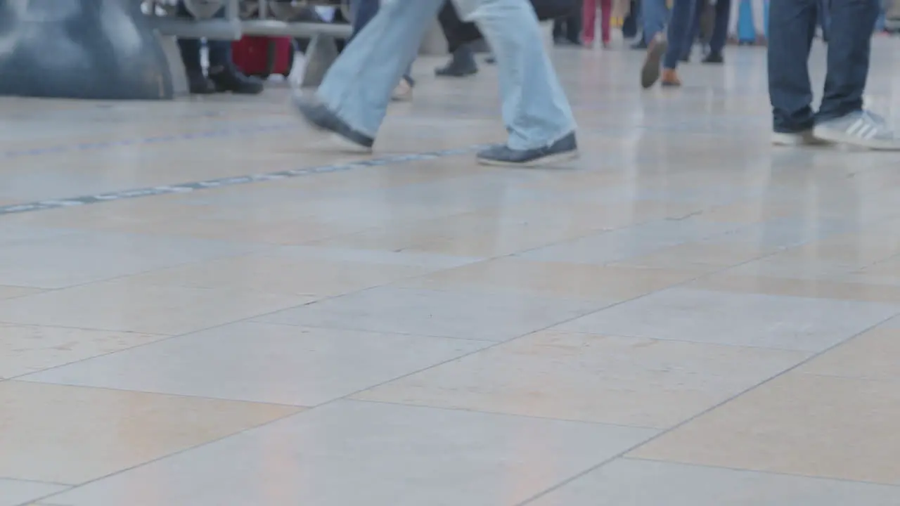 CU Feet walking in busy train station