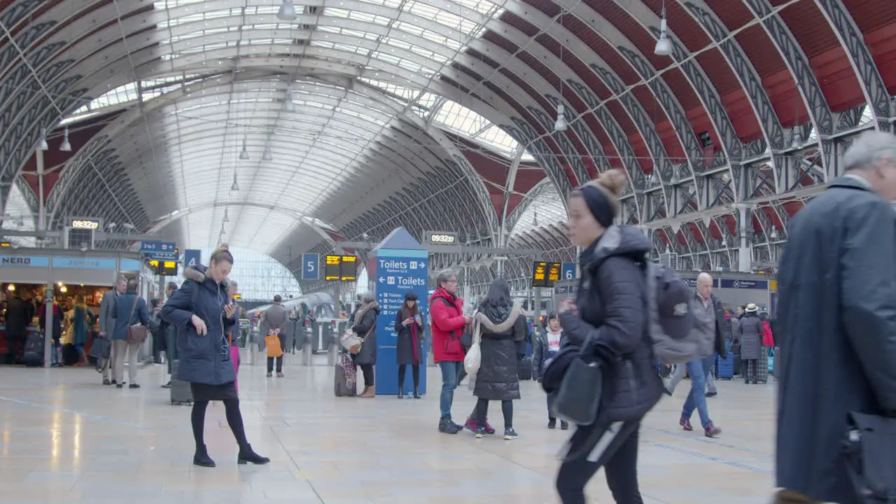 Woman waiting in Paddington Station in rush hour