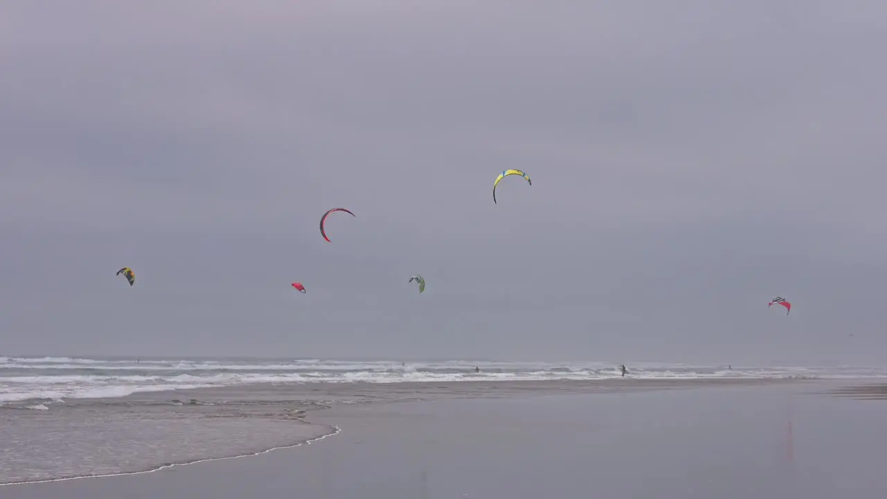 Kitesurfers on a Beach