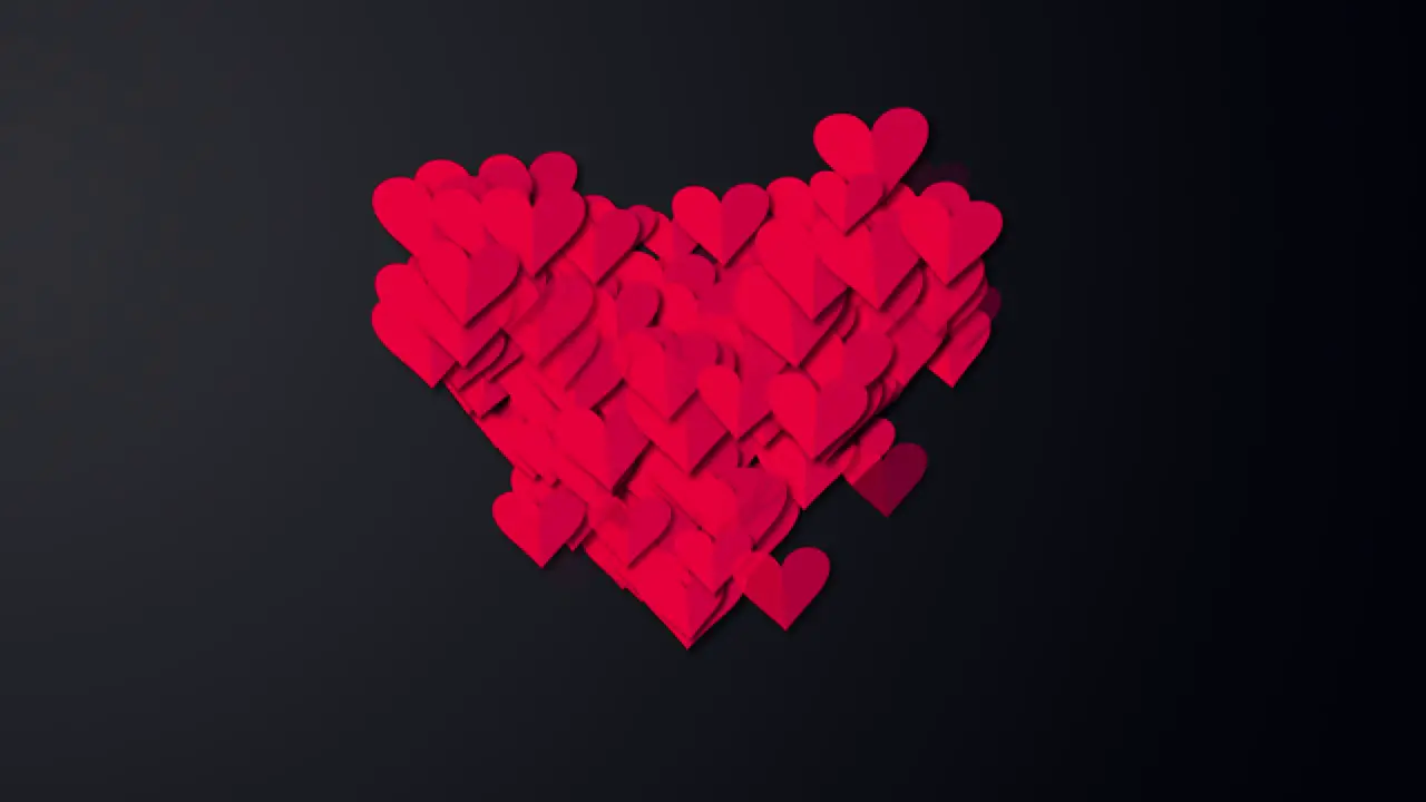 Small red hearts into big red heart on black screen