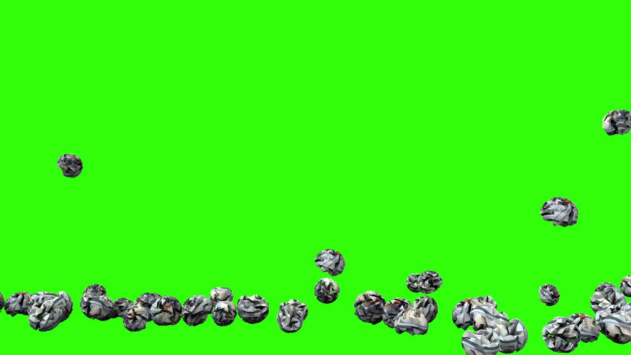 Crumpled usa dollars bills balls falling on green screen