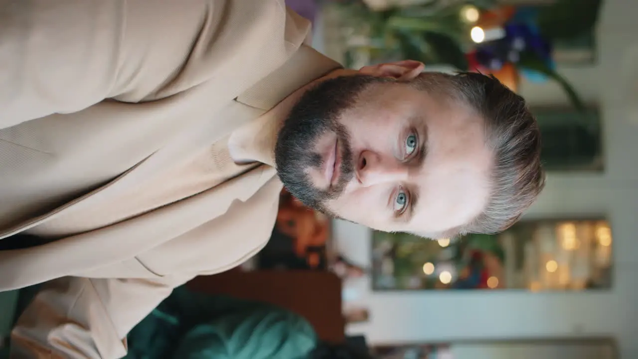 Portrait of Confident Caucasian Businessman in Cafe