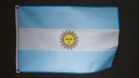 Studio Shot Of Flag Of Argentina Against Black Background