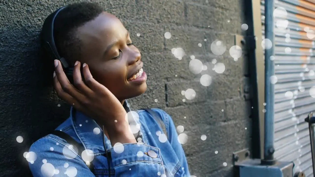 Woman listening to music surrounded by white bubbles effect