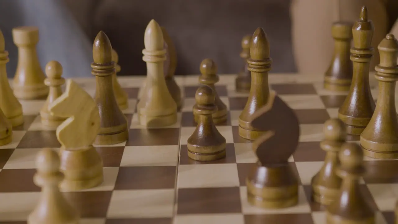 Close Up Of Two Unrecognizable People Playing Chess