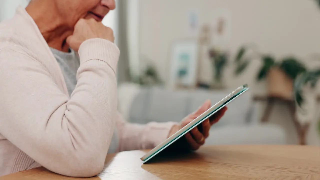 Hands tablet and a senior woman in her home