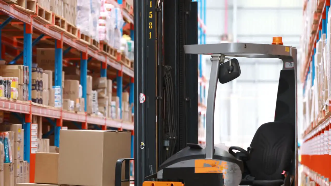 Forklift truck loaded with cardboard boxes