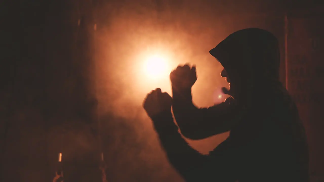 Boxer In Hoodie Warms Up By Punching The Air 1