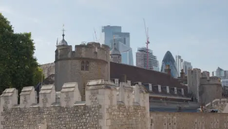 Exterior Of The Tower Of London With Modern City Skyline Behind England UK