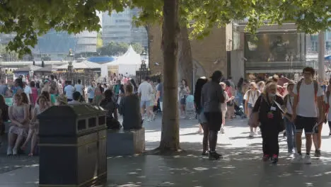 Crowd Of Summer Tourists Walking By The Tower Of London England UK