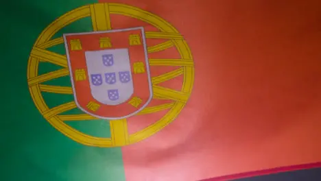 Close Up Studio Shot Of Portuguese Flag Flying Filling Frame