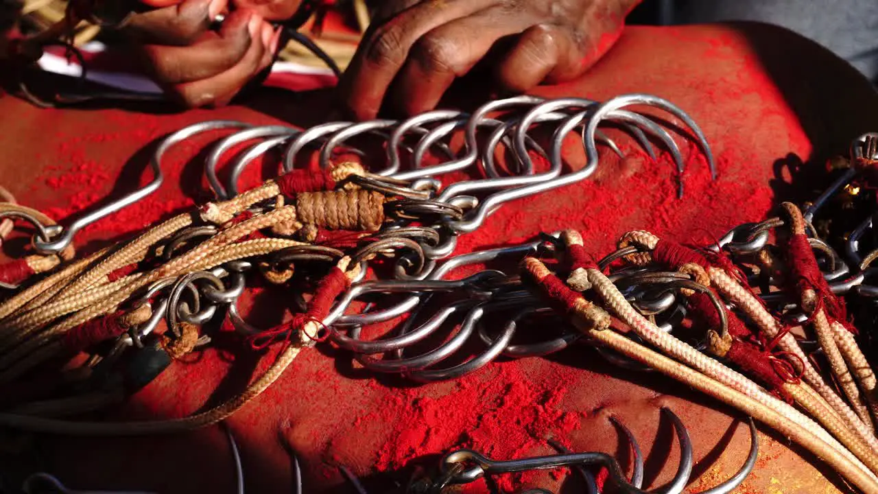 Close up of body piercing attached to rope