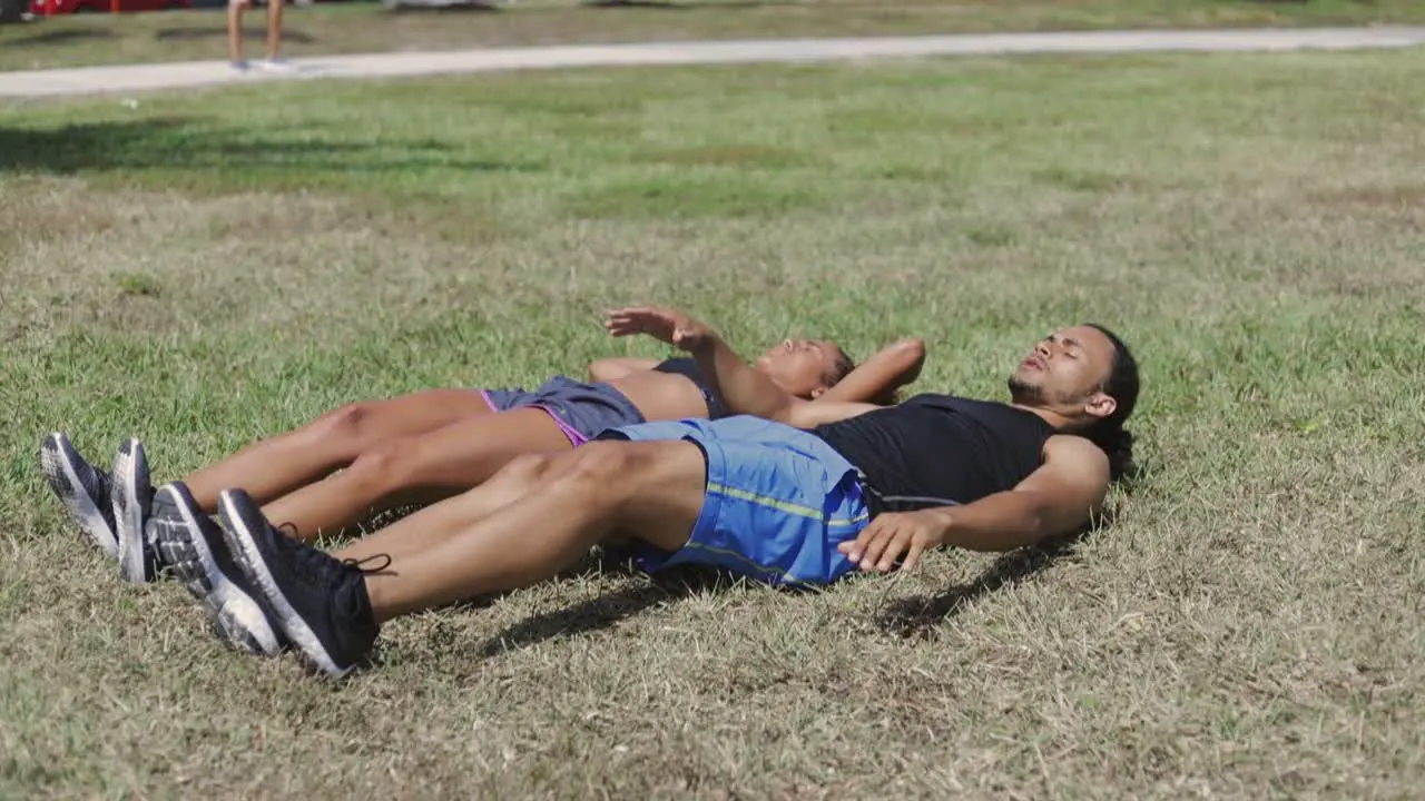 Couple exercising with legs up