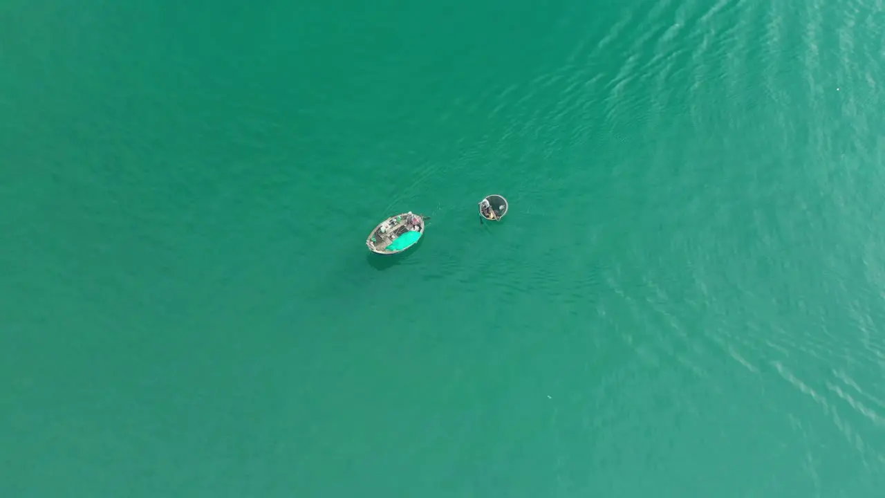 drone view fishermen is dragging a basket boat on My Khe beach Da Nang city Vietnam