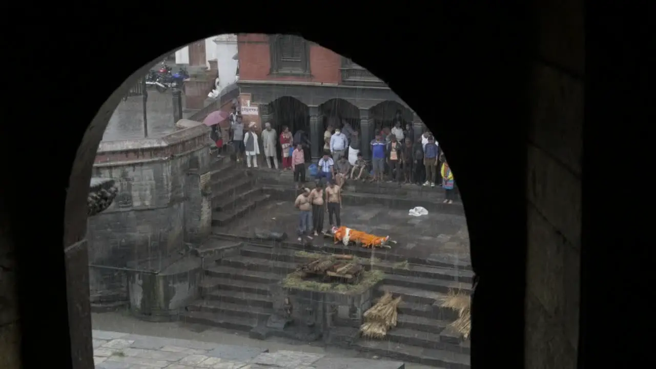 Open Cremation Ceremony in Heavy Rain in Pashupatinath Temple Kathmandu Nepal