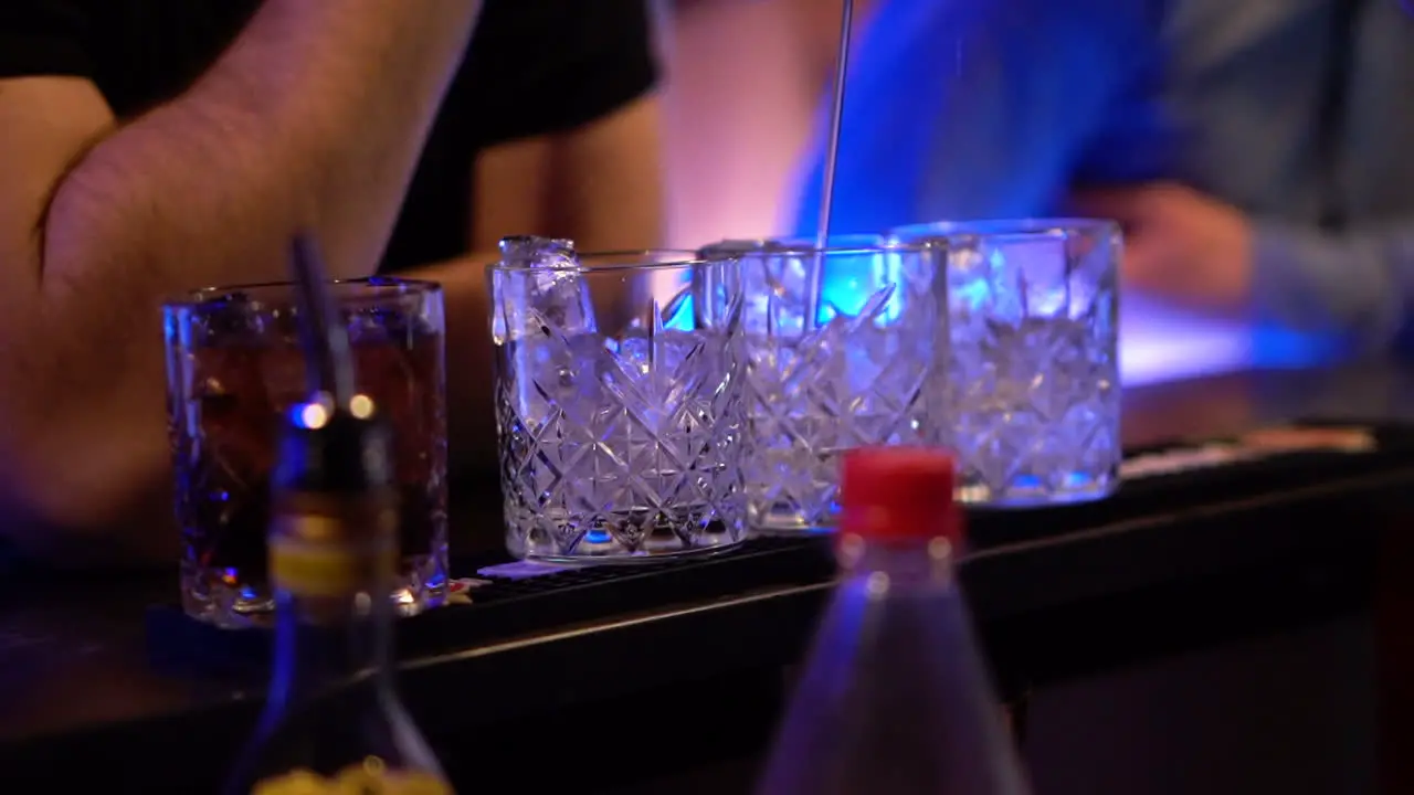 Drinks and cocktail being made in the bar of a club