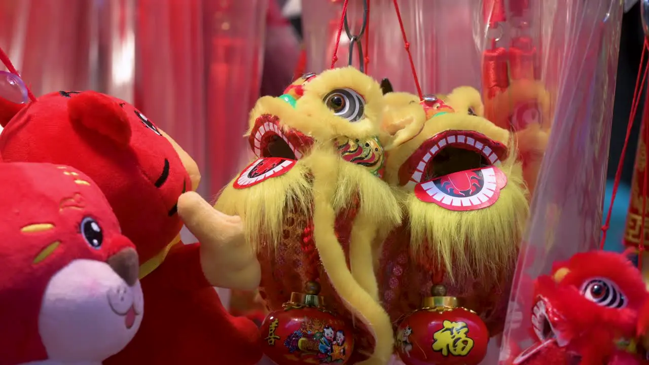 Chinese New Year decorative ornaments such as yellow lions seen for sale at a shop during the Lunar Chinese New Year in Hong Kong