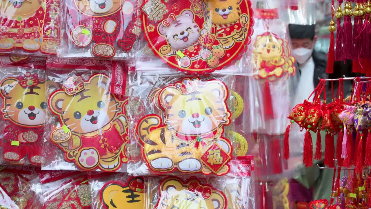 Chinese New Year ornaments and gifts for sale at a street market stall during the Lunar Chinese New Year in Hong Kong