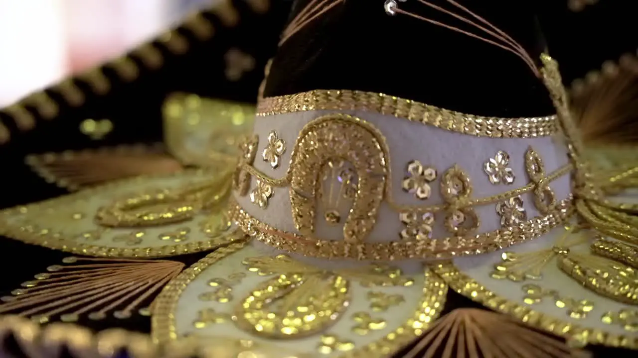 Close up of a sombrero with golden designs and details