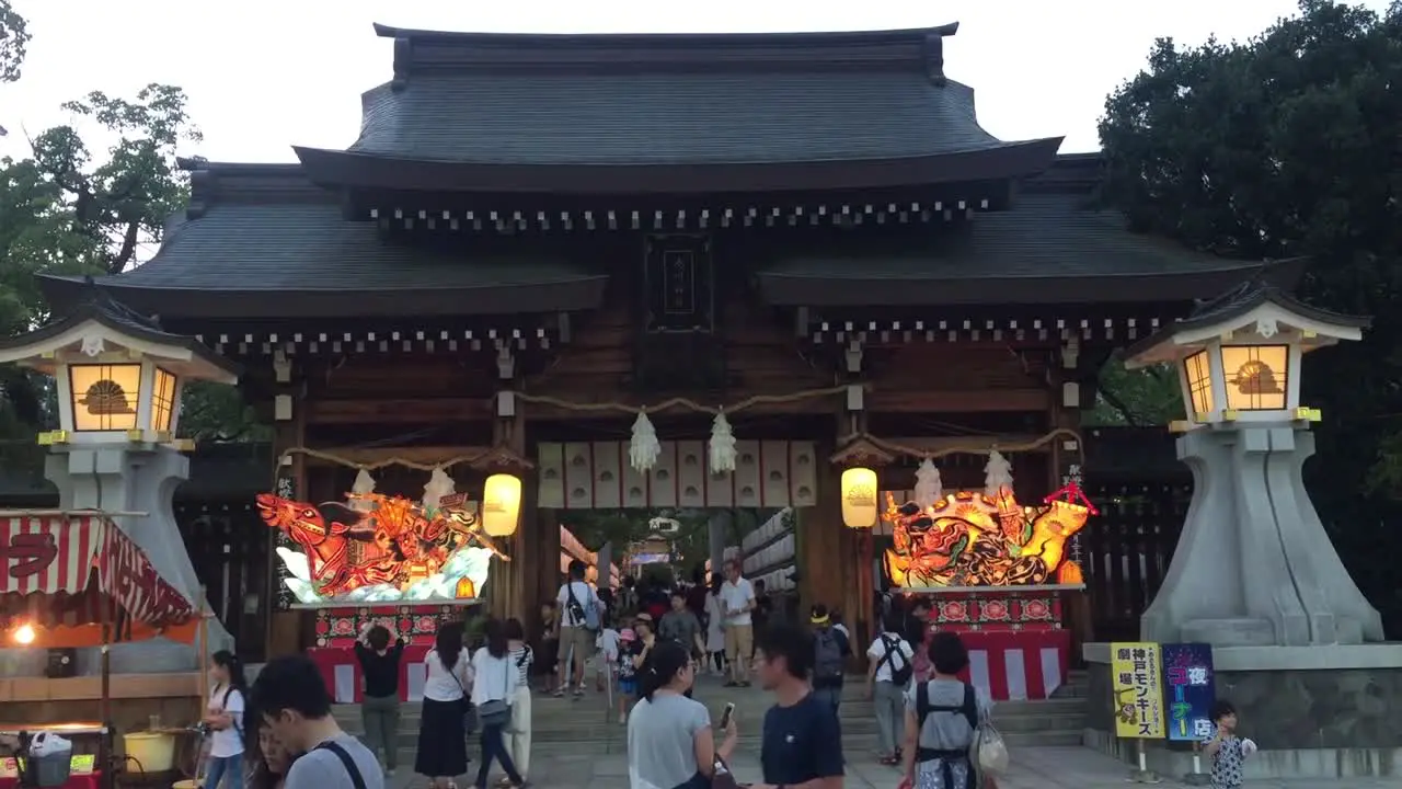 People walking under a Japanese Building in Osaka Japan