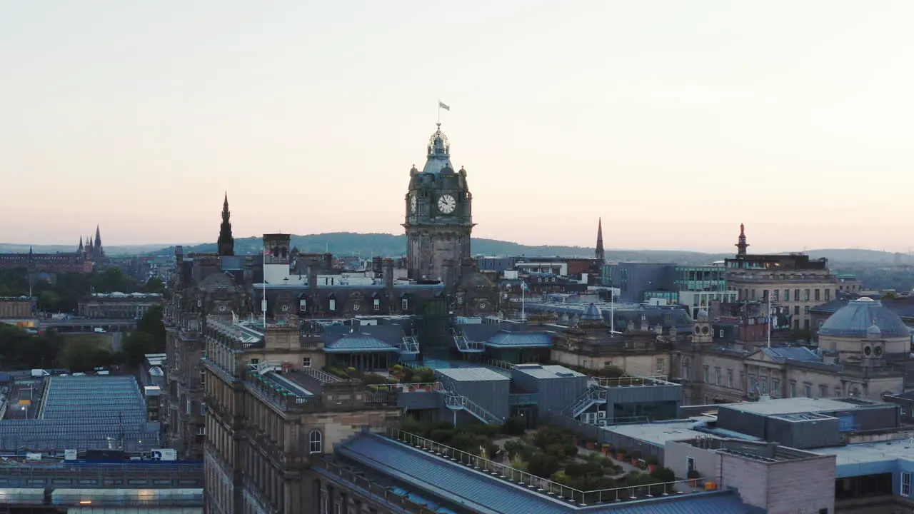 Aerial shot of Edinburgh at sunset featuring a large clock tower