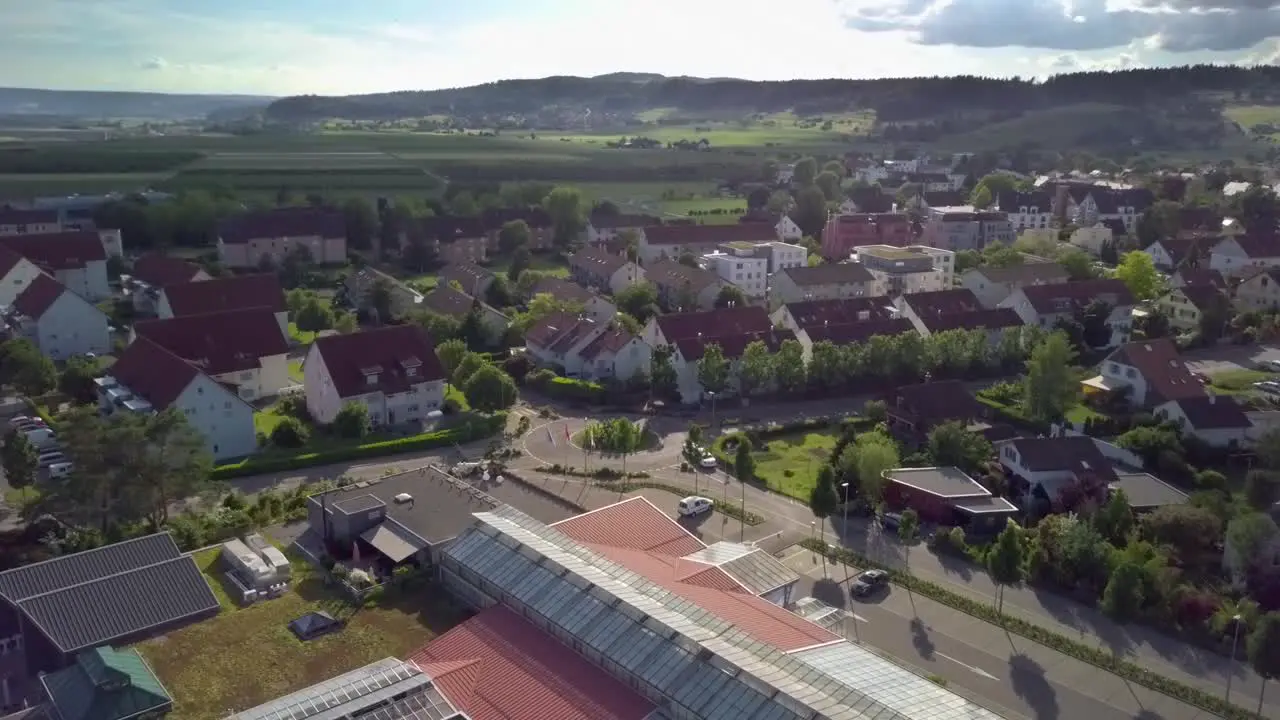 A limousine is driving through a roundabout and drives further away into the sunset in Switzerland