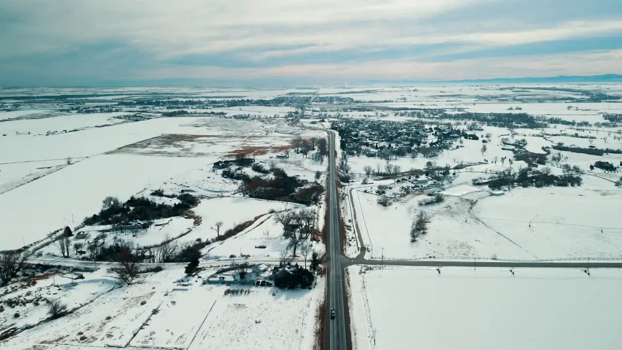 aerial view of snowy road in west coast usa sunset colors