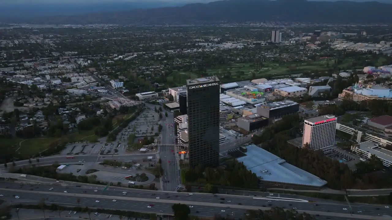 Aerial view around the Comcast NBC universal city plaza tower sunset in Los Angeles USA